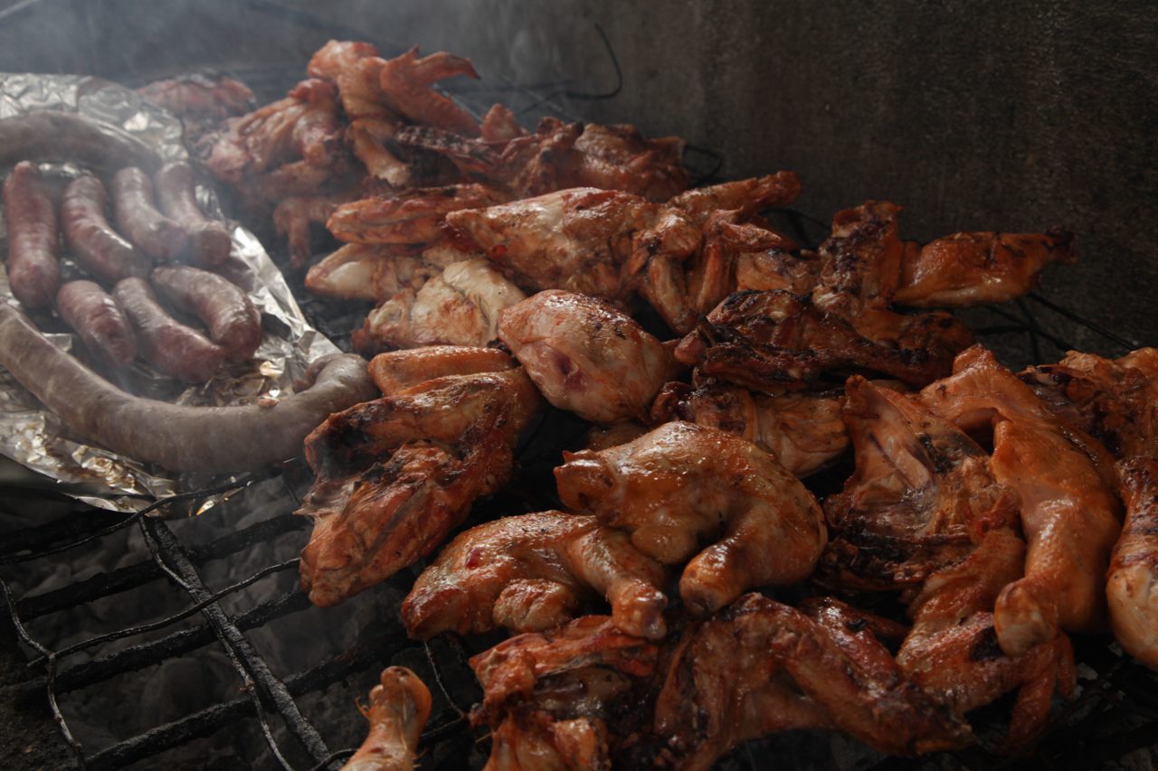 Chicken and sausages on the grill